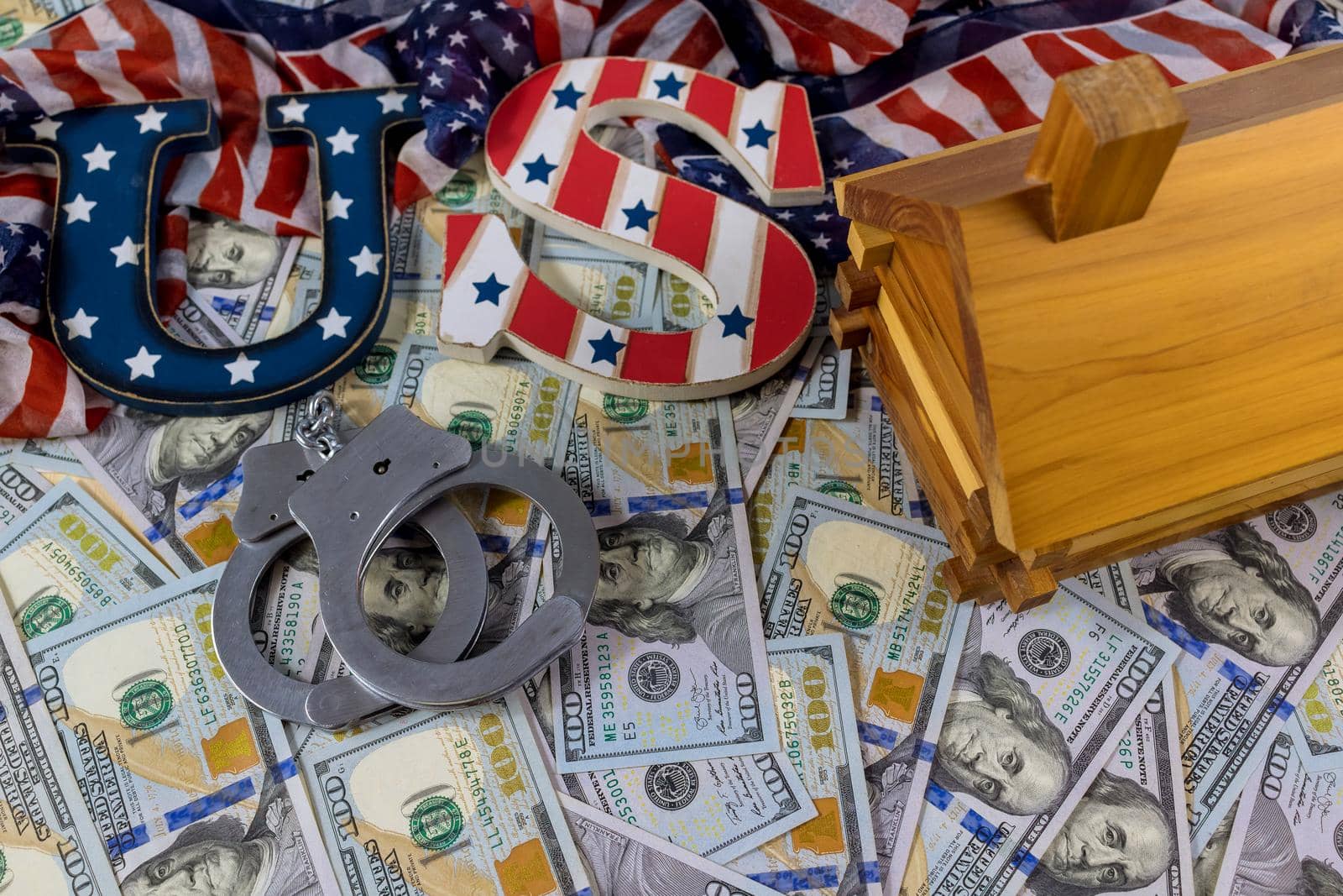 Judge american sanctions the court imposed an arrest to on house of property with US dollars banknotes handcuffs Judge gavel