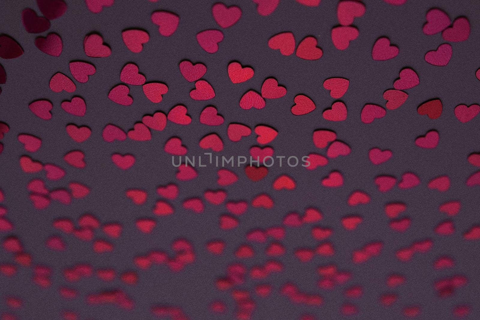 Beautiful heart confetti falling on the dark background. Invitation Template Background design, greeting cards, poster. Valentine's Day