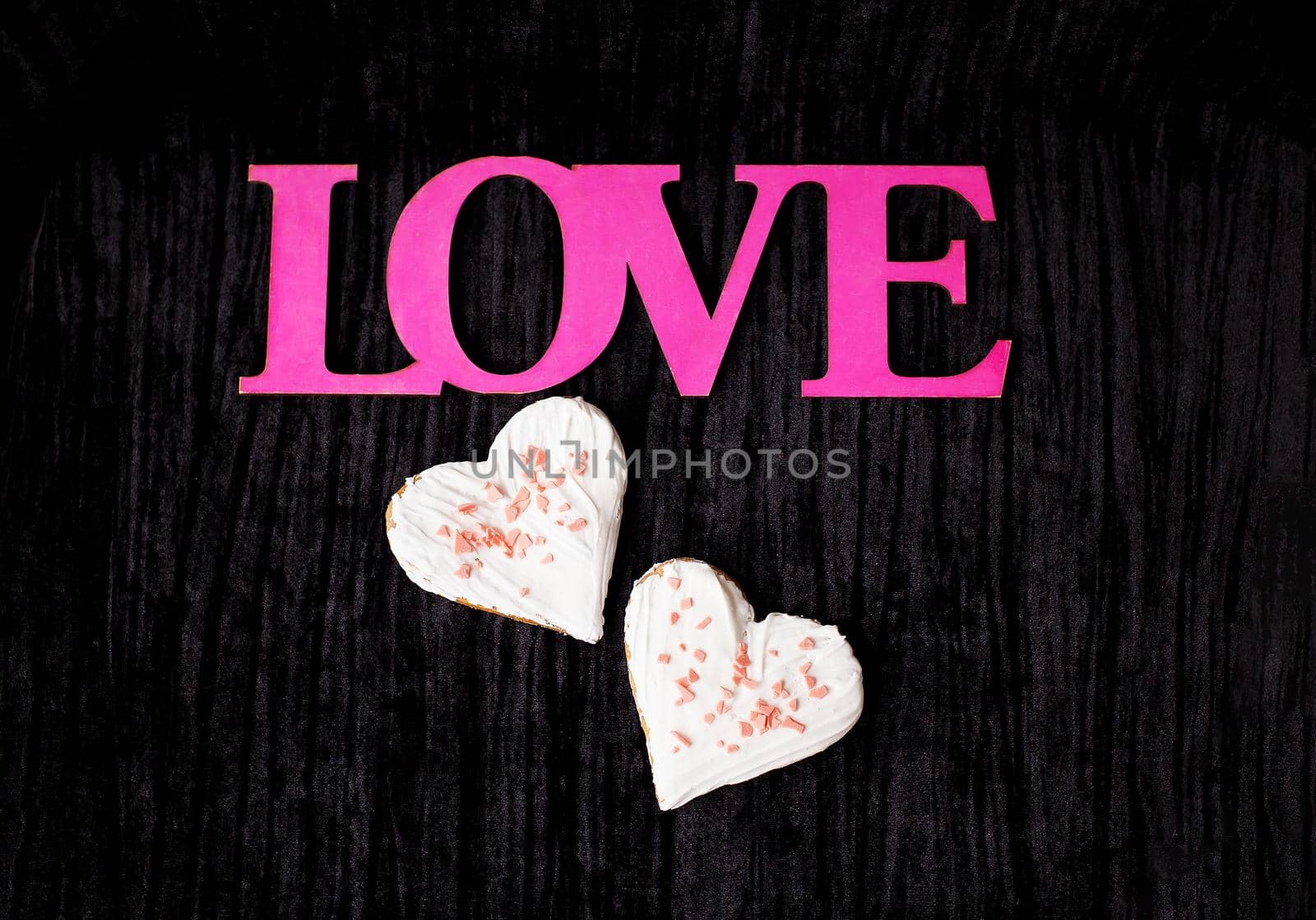 Cookies in the form of heart - pink inscription love.