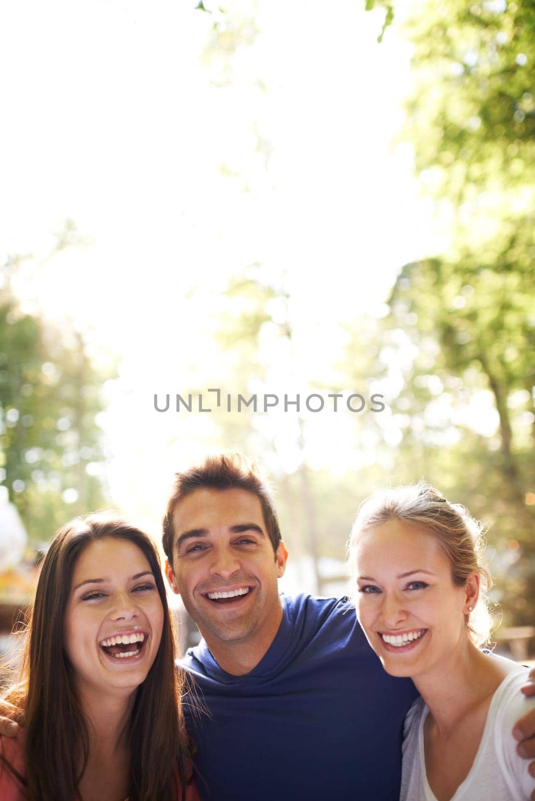 A group of friends having fun together outdoors - with copy space