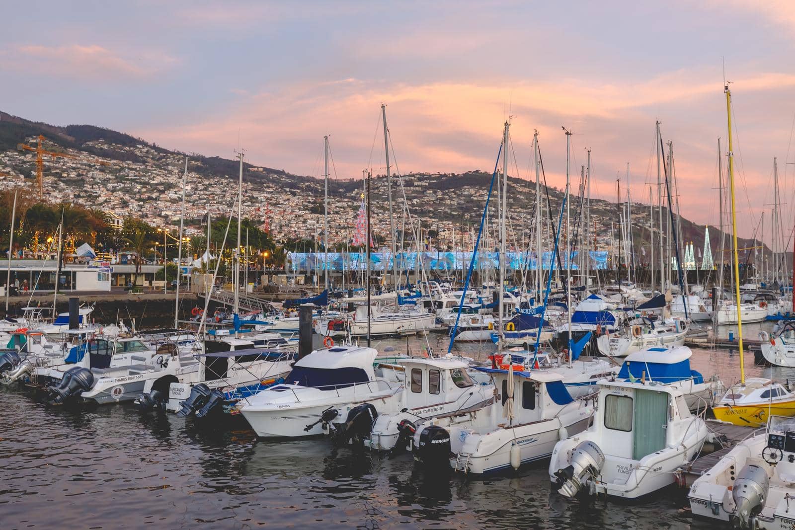 Funchal marina in the evening where people gather to watch the new year fireworks by AtlanticEUROSTOXX