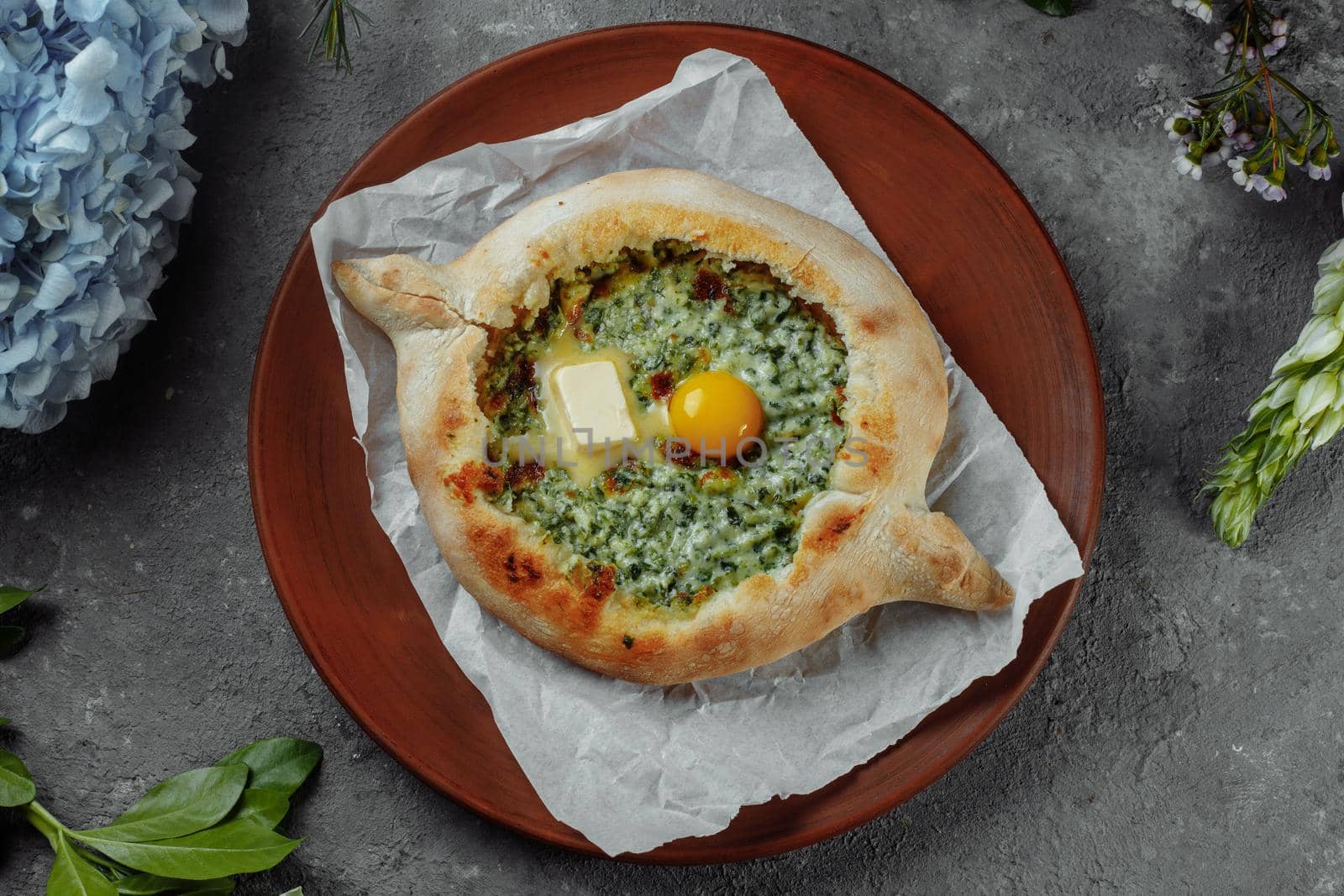 Some khachapuri traditional Georgian homemade cheese and spinach pies on the plate by UcheaD