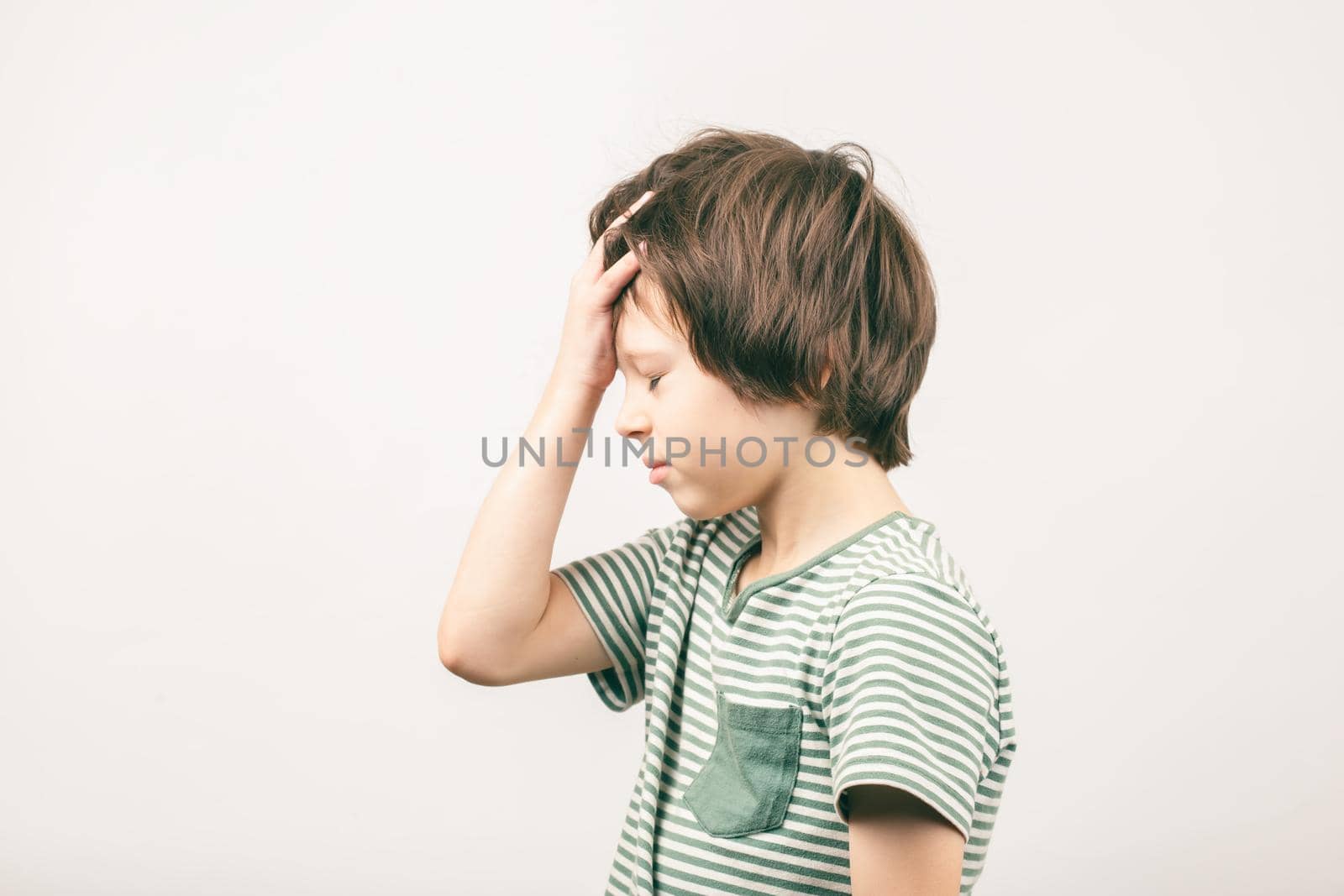 Boy placing hand on head. Face palm gesture by Syvanych