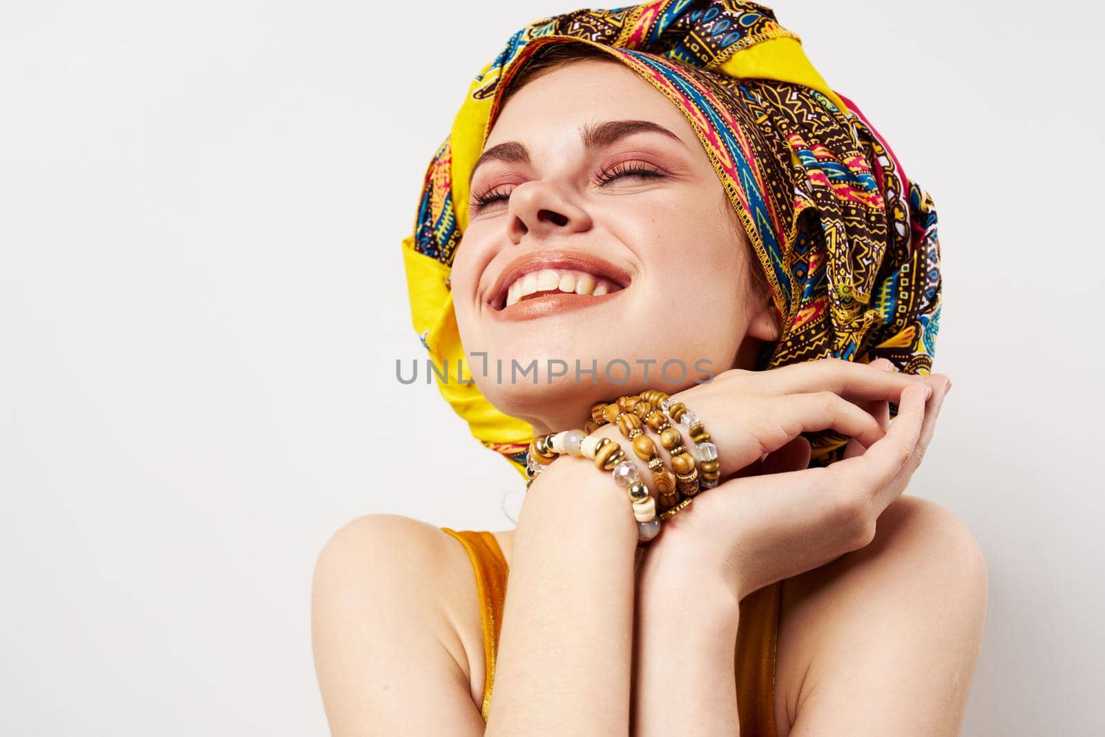 pretty woman multicolored turban ethnicity fashion posing. High quality photo