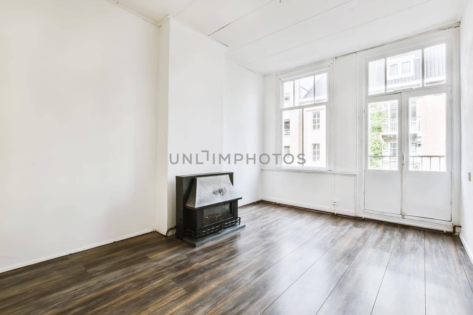 Spectacular design of the room with fireplace and parquet floor