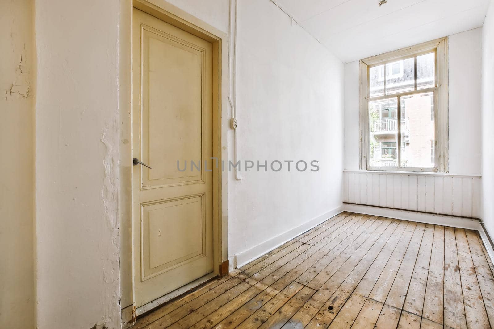 An exciting design of a room with large windows and a door