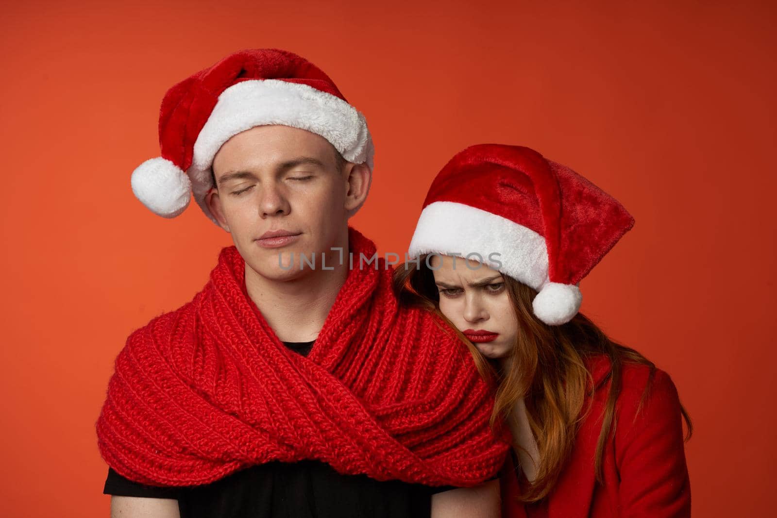 young couple in New Year's clothes Christmas holiday isolated background. High quality photo