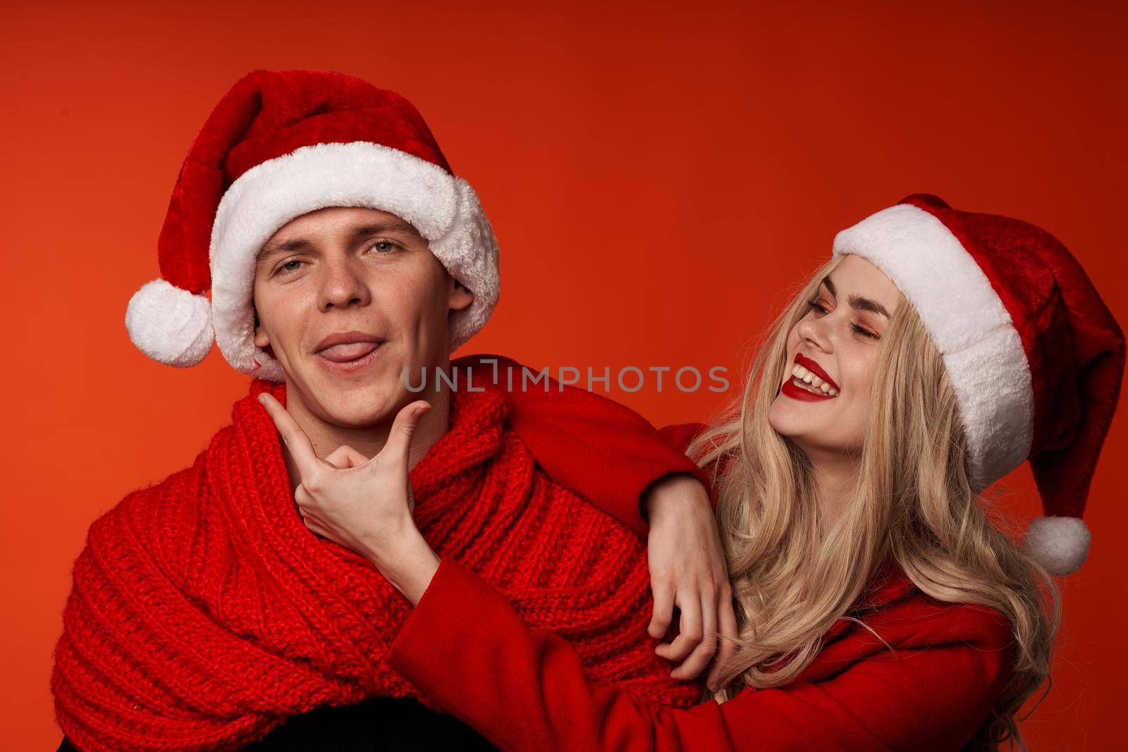 young couple together holiday romance New year fun isolated background by SHOTPRIME