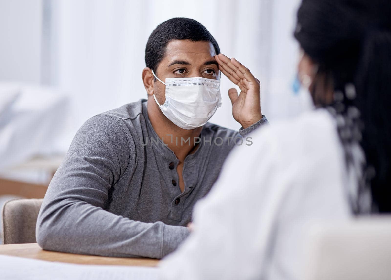 Shot of a young man having a consultation with a doctor