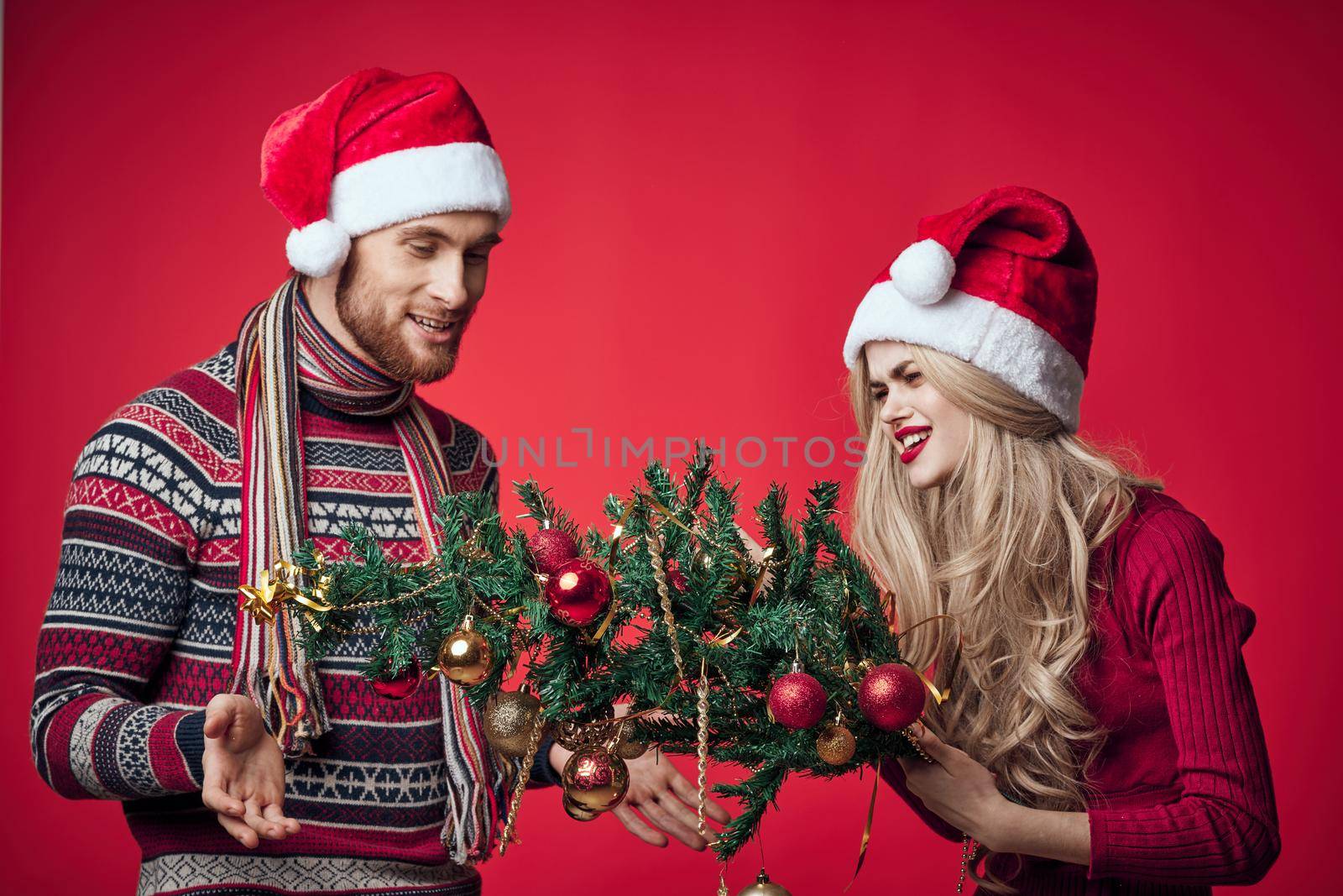 young couple in new year clothes together holiday emotions merry christmas by SHOTPRIME