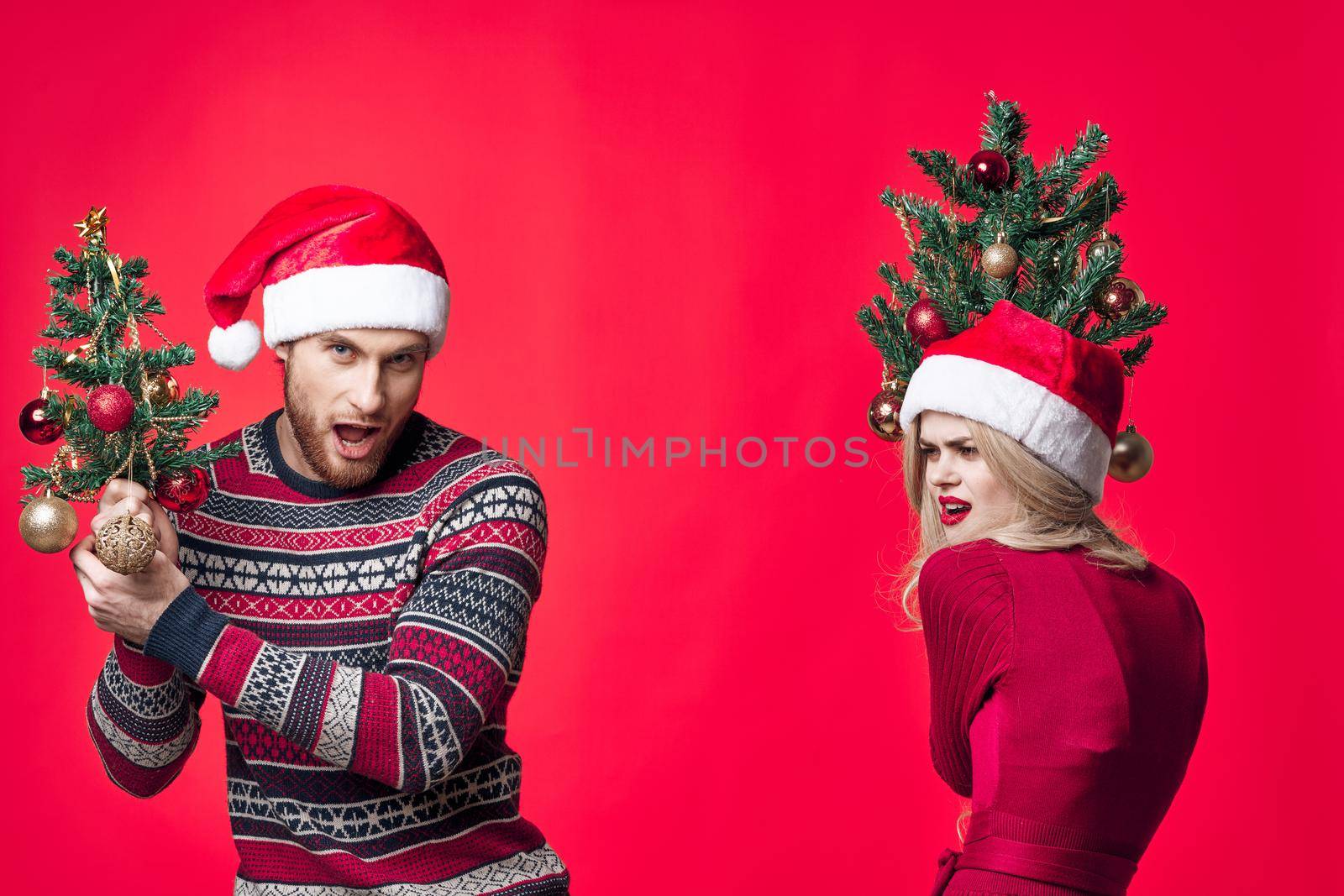 young couple holiday fun joy christmas decoration by SHOTPRIME