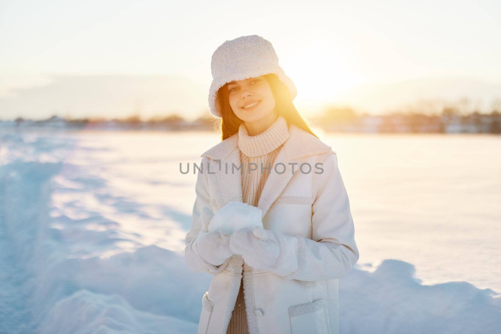 pretty woman red hair snow field winter clothes Sunny winter day Lifestyle. High quality photo