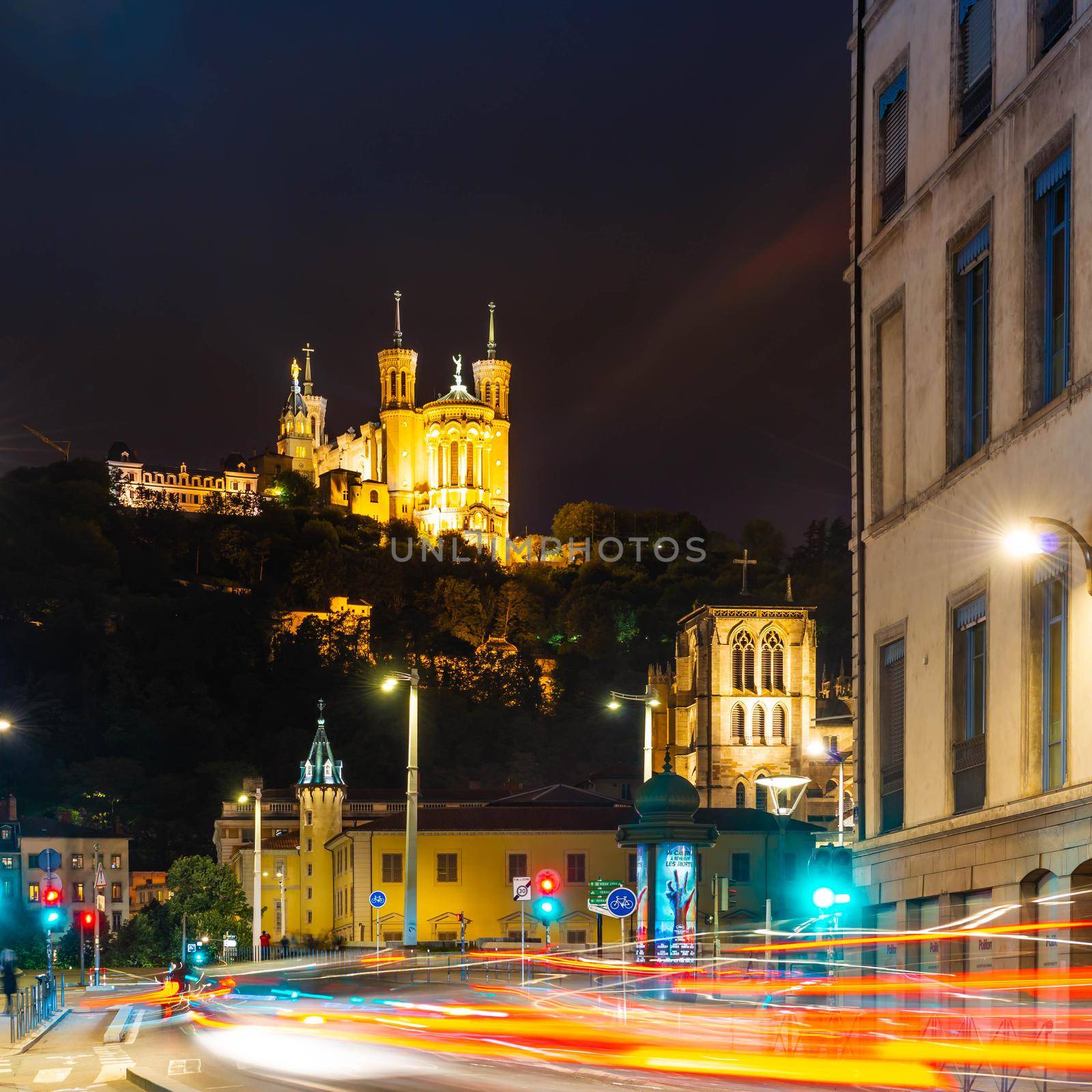 Lyon with Saint-Jean-Baptiste cathedral and Fourviere basilica in the background at night, Rhone, France by Frederic