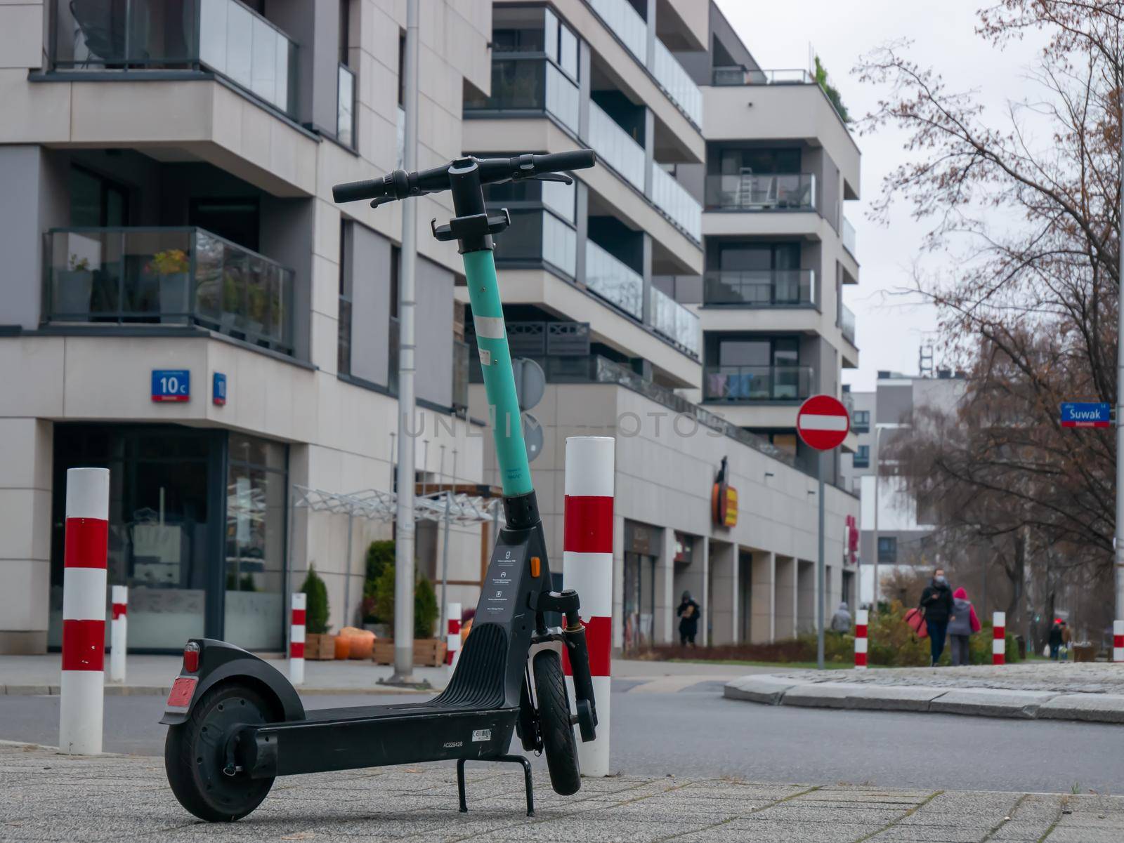 Close up of electric scooter back view on the road in city