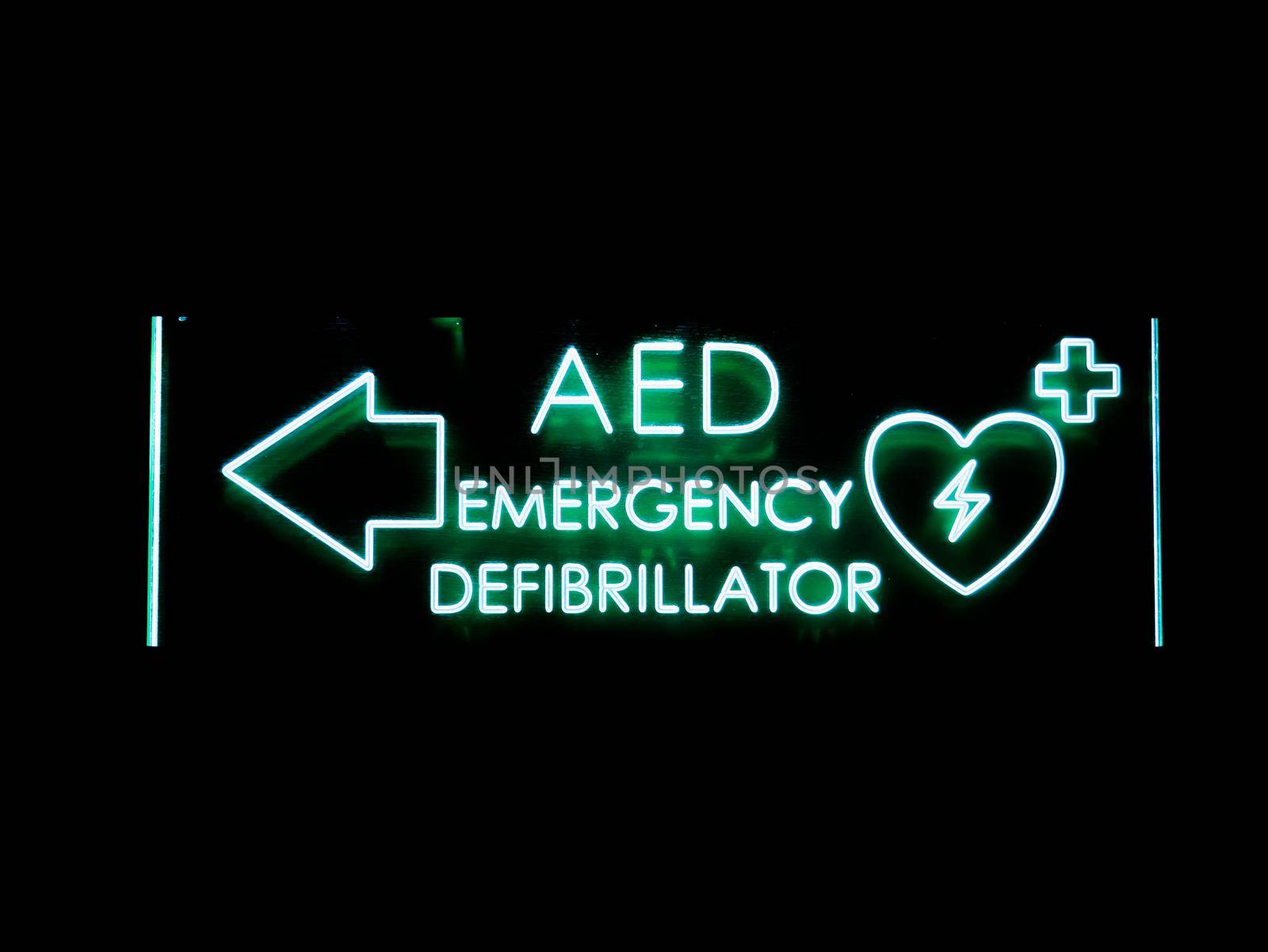 Emergency defibrillator DEA or AED sign lighted heart
