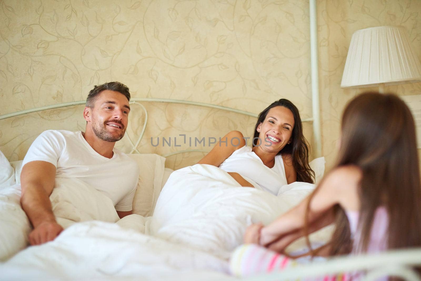 Shot of a family in the bedroom at home