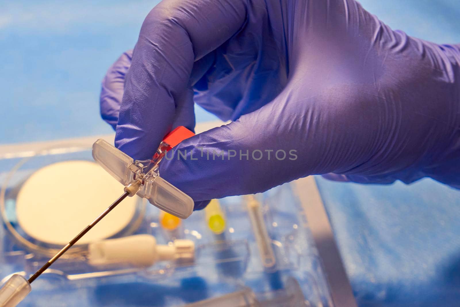 Epidural Anesthesia. Tuohy needle in doctor's hands