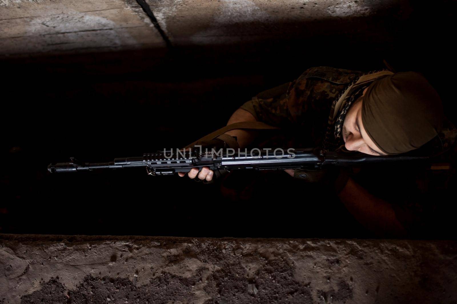 Arab soldier aiming with Kalashnikov AK-47 assault rifle.
