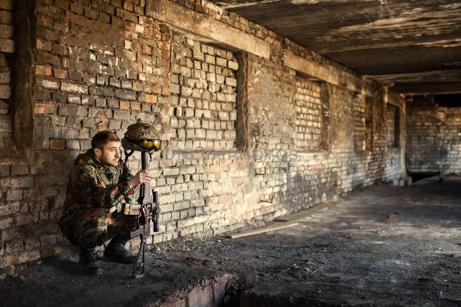 A thoughtful soldier, resting from a military operation Location of ruins