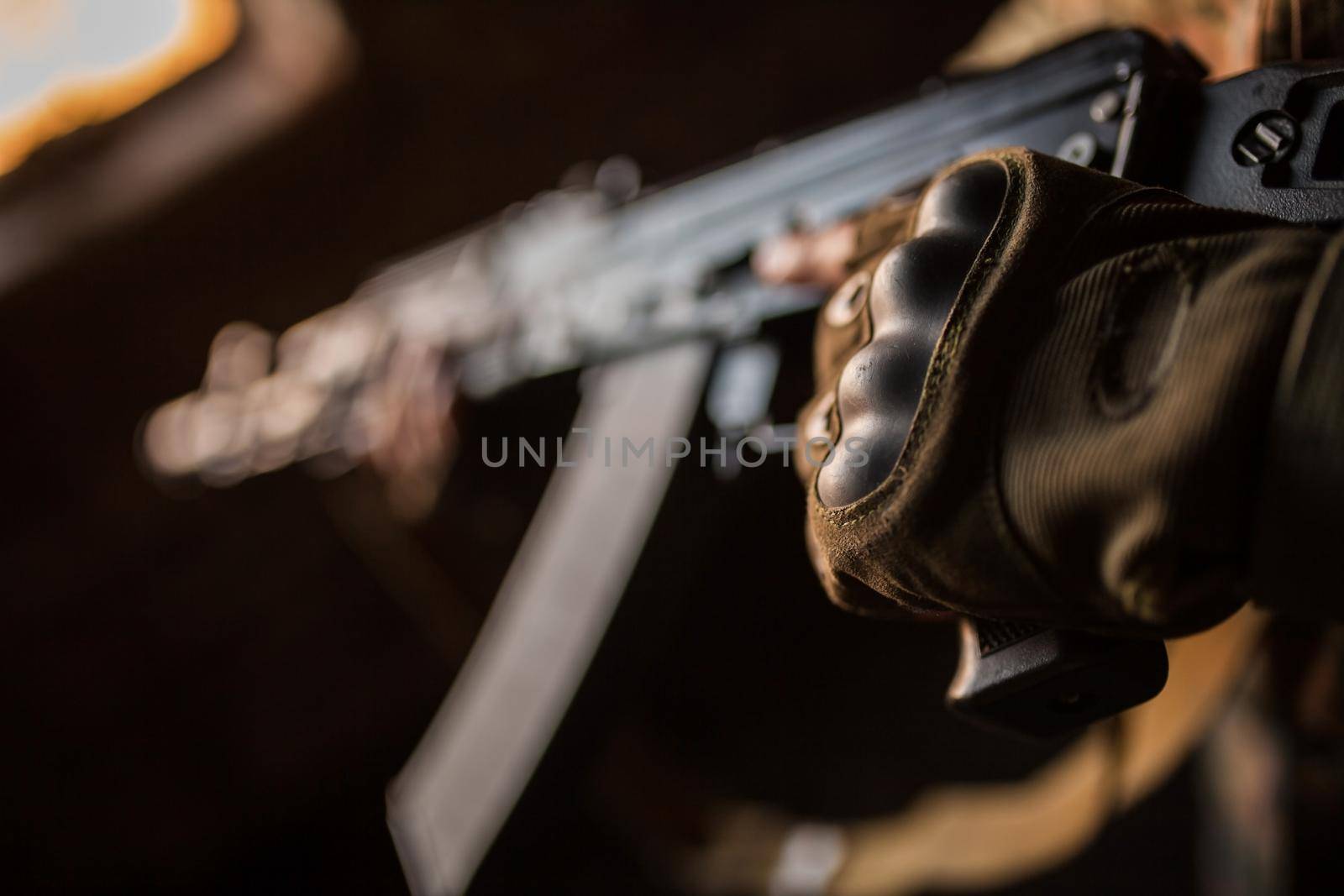 Portrait of serious middle eastern man with AK-47