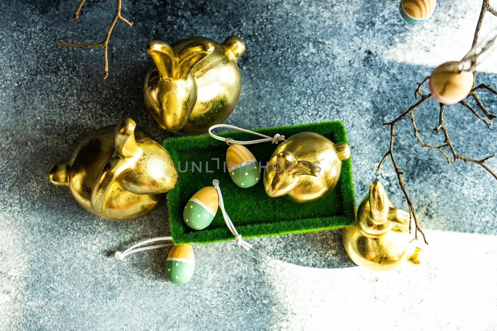 Place setting for festive Easter dinner using with golden bunnies