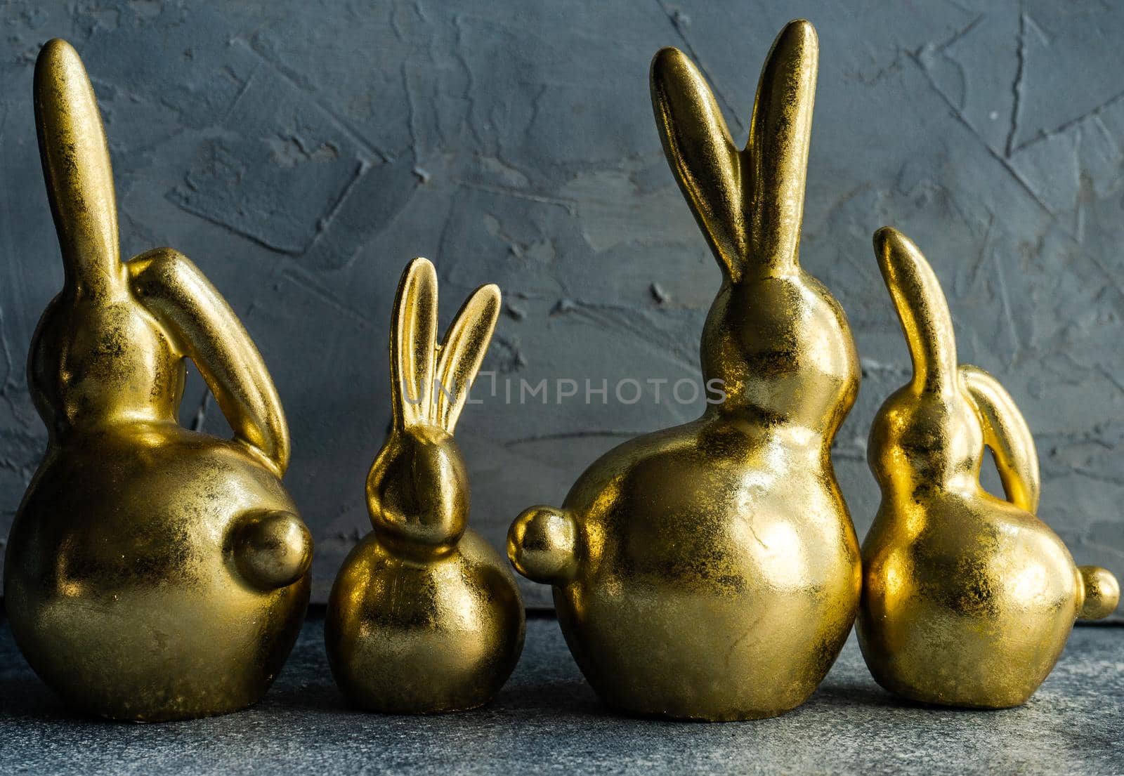 Place setting for festive Easter dinner using with golden bunnies