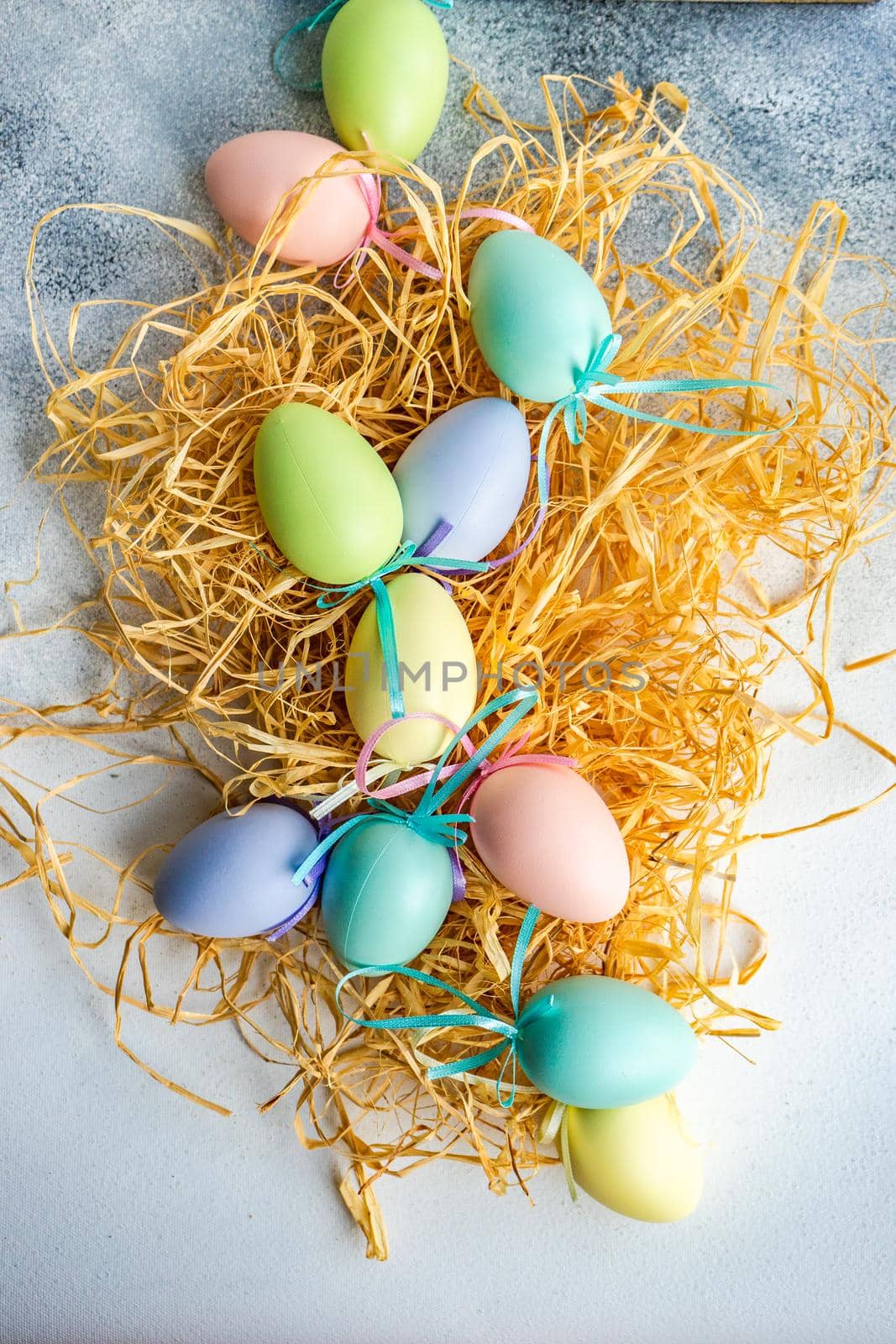 Box full of colorful eggs on rustic background