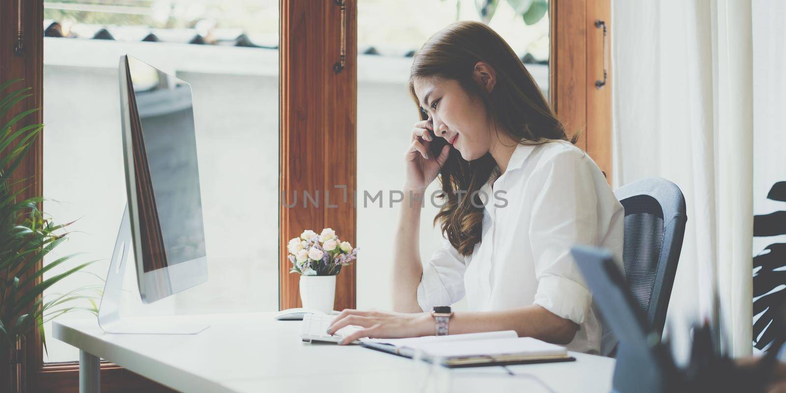 Job interview concept. Business woman questioning and listen to candidate answers during interview by video call on computer desktop. by itchaznong