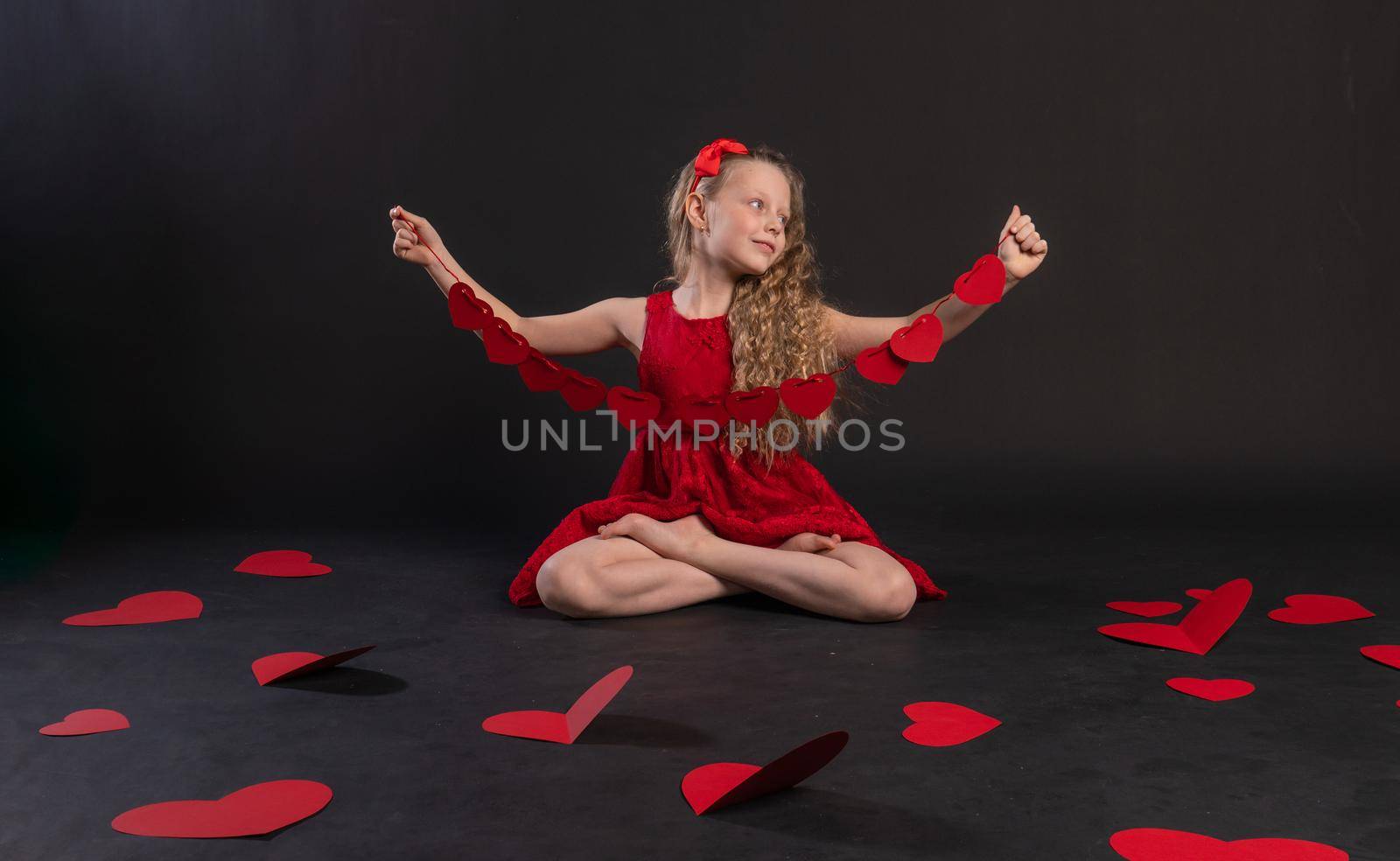paper hearts Valentine's , on the floor of the hearts are lovely . the inspiration of the occasion. feeling, engagement in red dress girl, barefoot