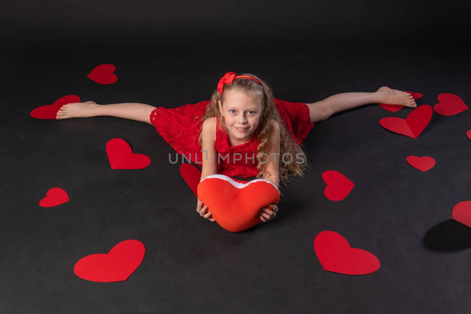 In twine paper hearts valentine valentine background, valentine's day heart, on the floor hearts married . the formula of art. copy space festive, black in red dress girl, barefoot