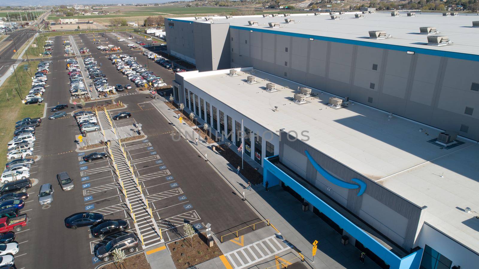 NAMPA, IDAHO - APRIL 27, 2012: Aerial view of an amazon fulfillment center with employees entering or leaving the building