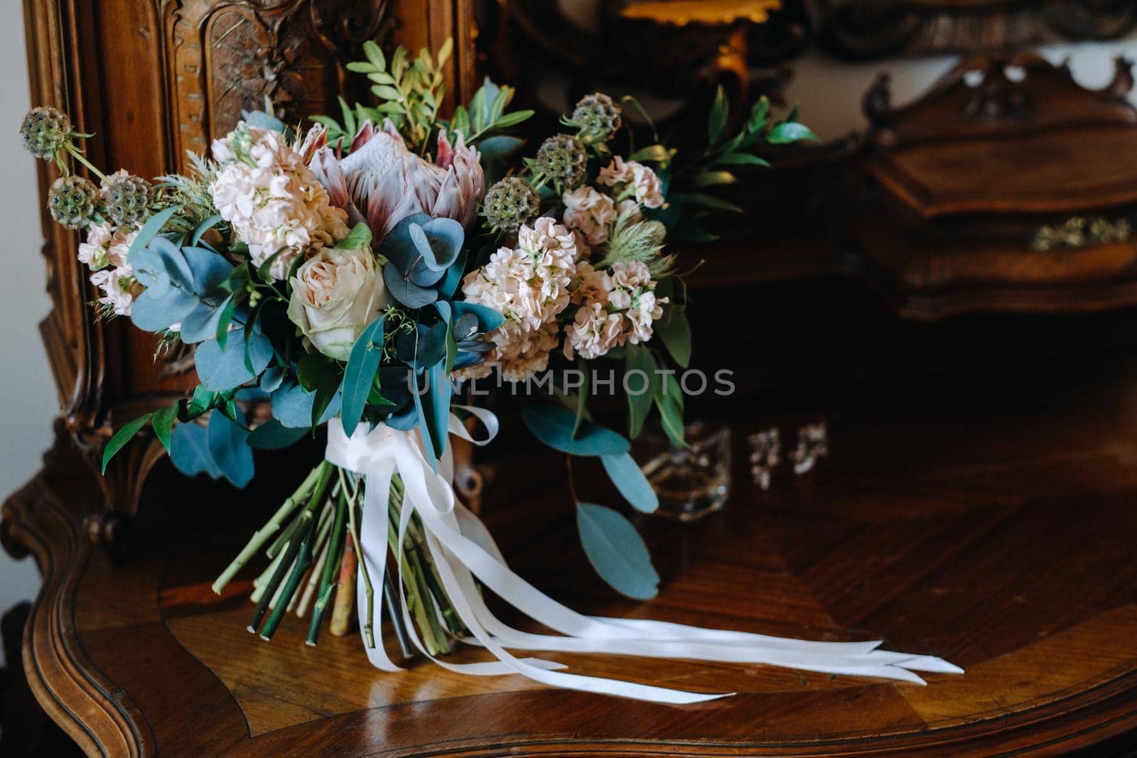 Wedding bouquet of roses lying on the surface. Wedding floristry.