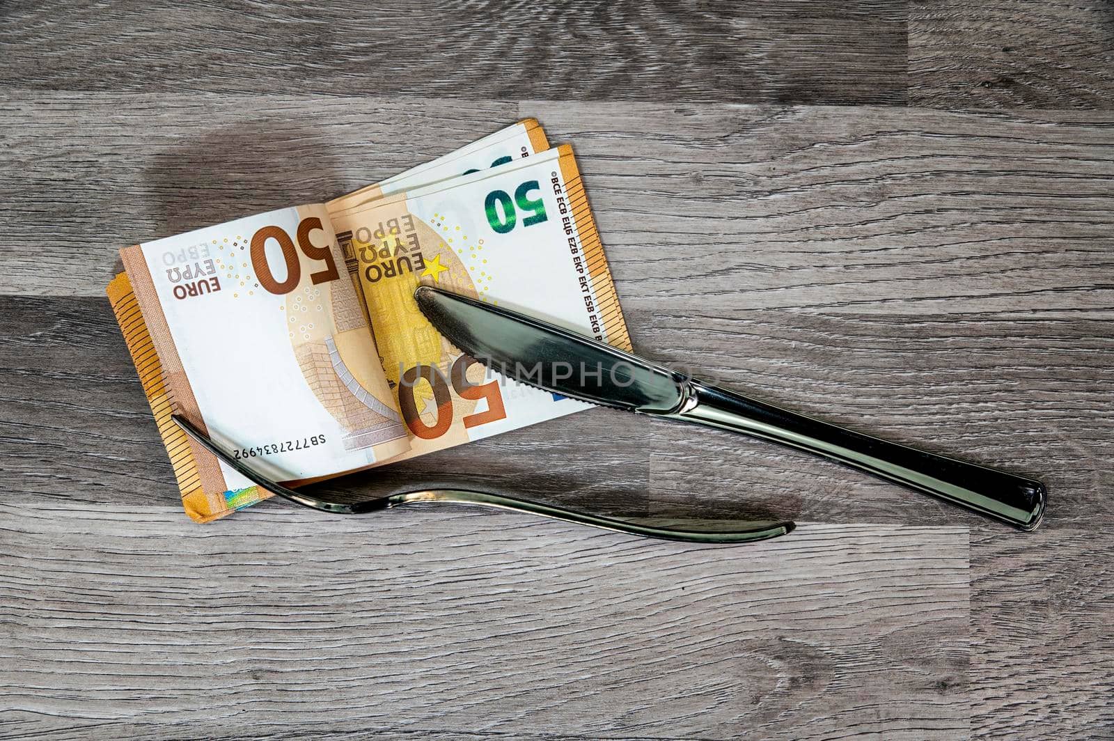 50 euro banknotes with fork and knife by carfedeph