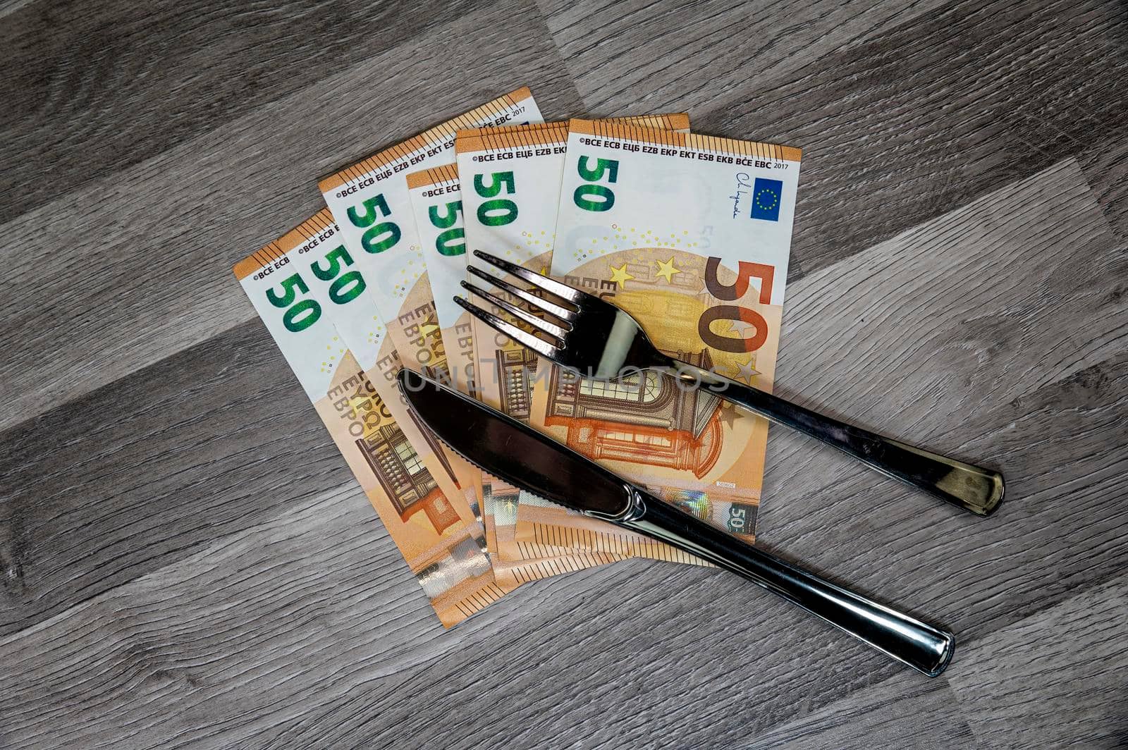 50 euro banknotes with fork and knife by carfedeph