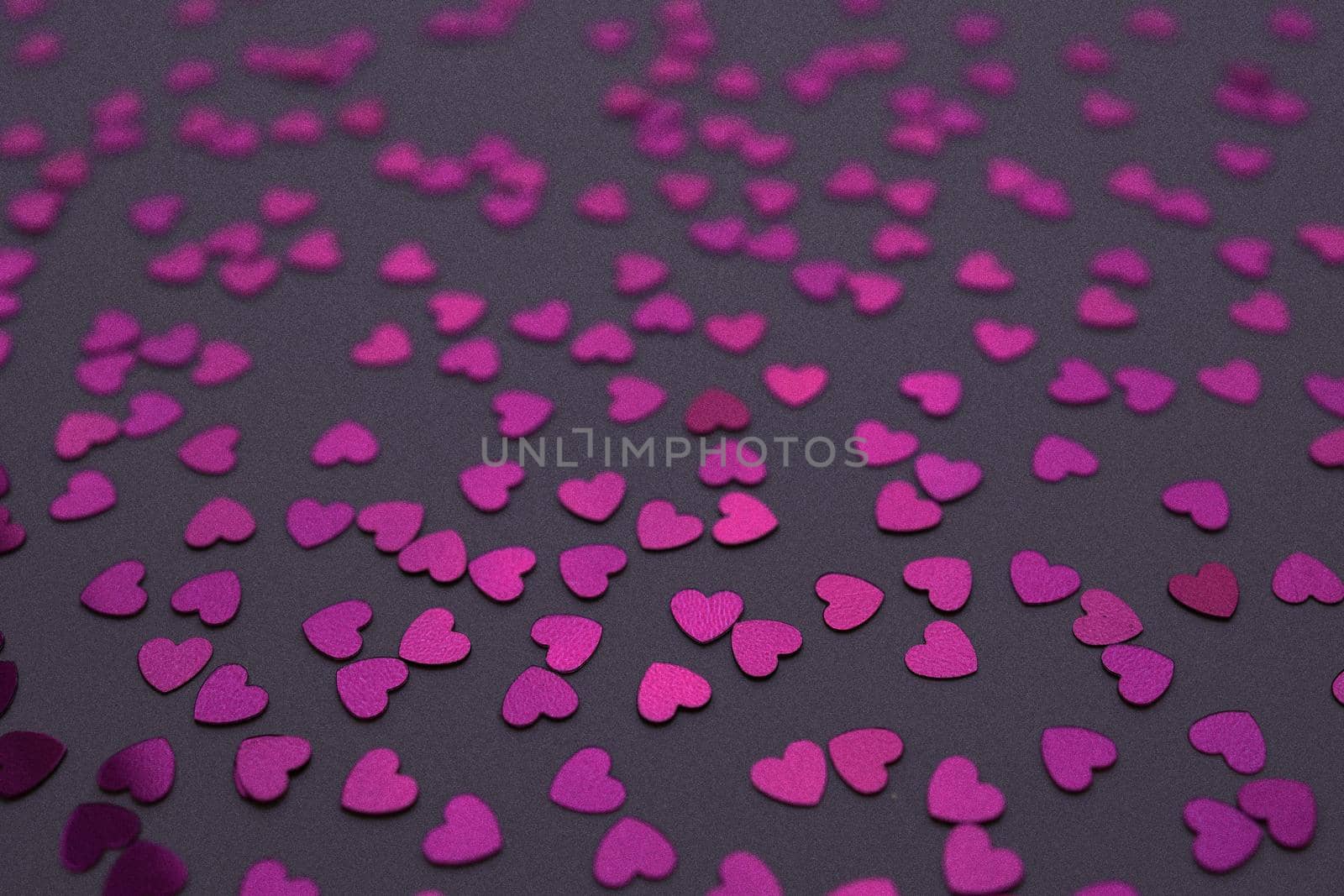 Beautiful heart confetti falling on the dark background. Invitation Template Background design, greeting cards, poster. Valentine's Day