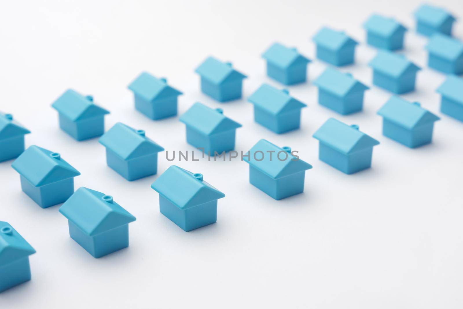 Miniature home property background real estate design. Suburban house residential neighborhood home real estate property symbol house of blues. Cottage village of miniature house model homes for sale by synel