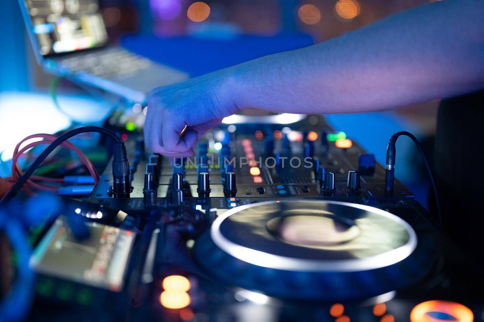 Dj mixing at party festival with light and smoke in background - Summer nightlife view of disco club inside. by HERRAEZ