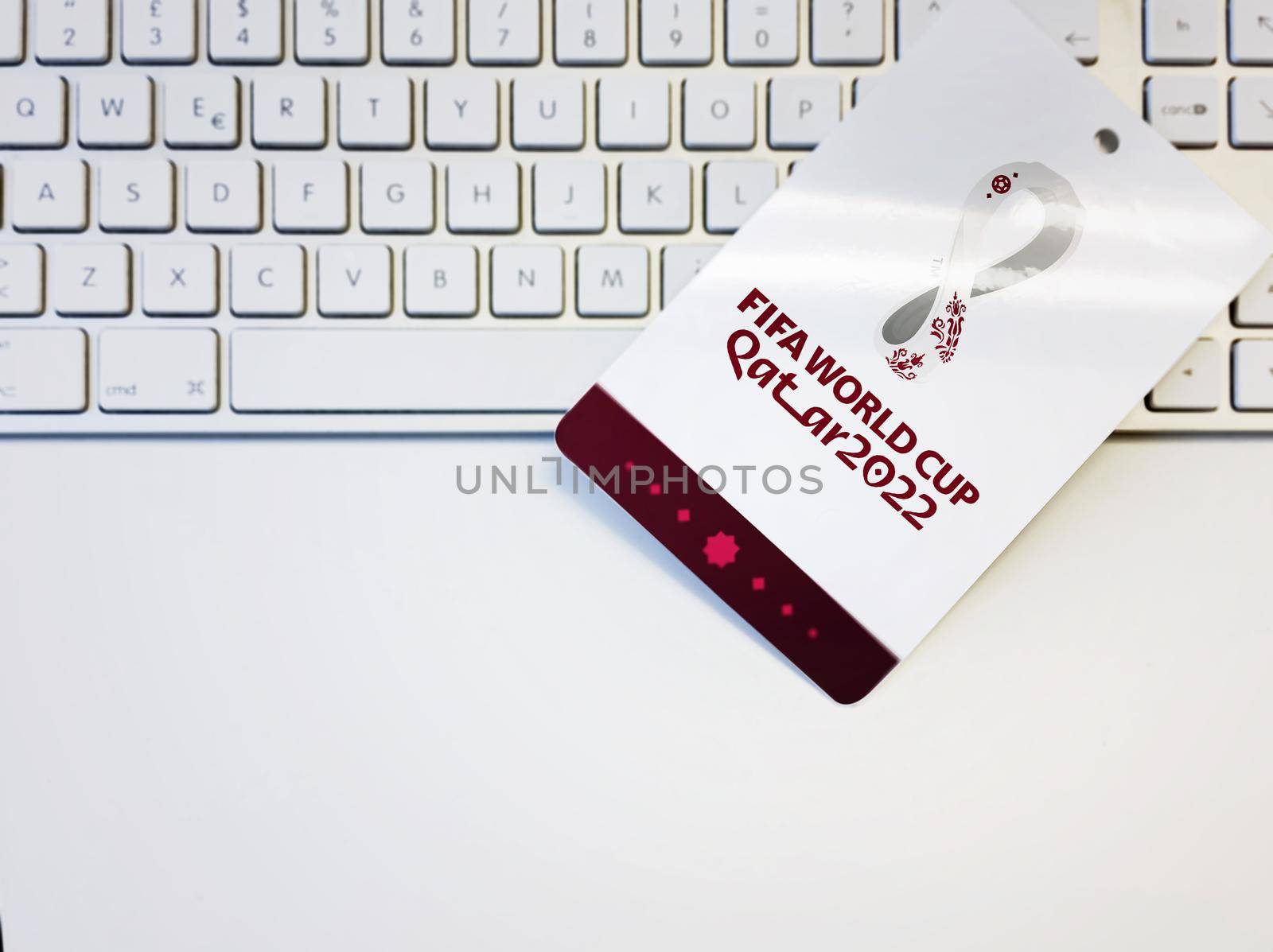 Doha, Qatar, October 2021: Blank white badge with the Fifa 2022 world cup logo on a computer keyboard by rarrarorro