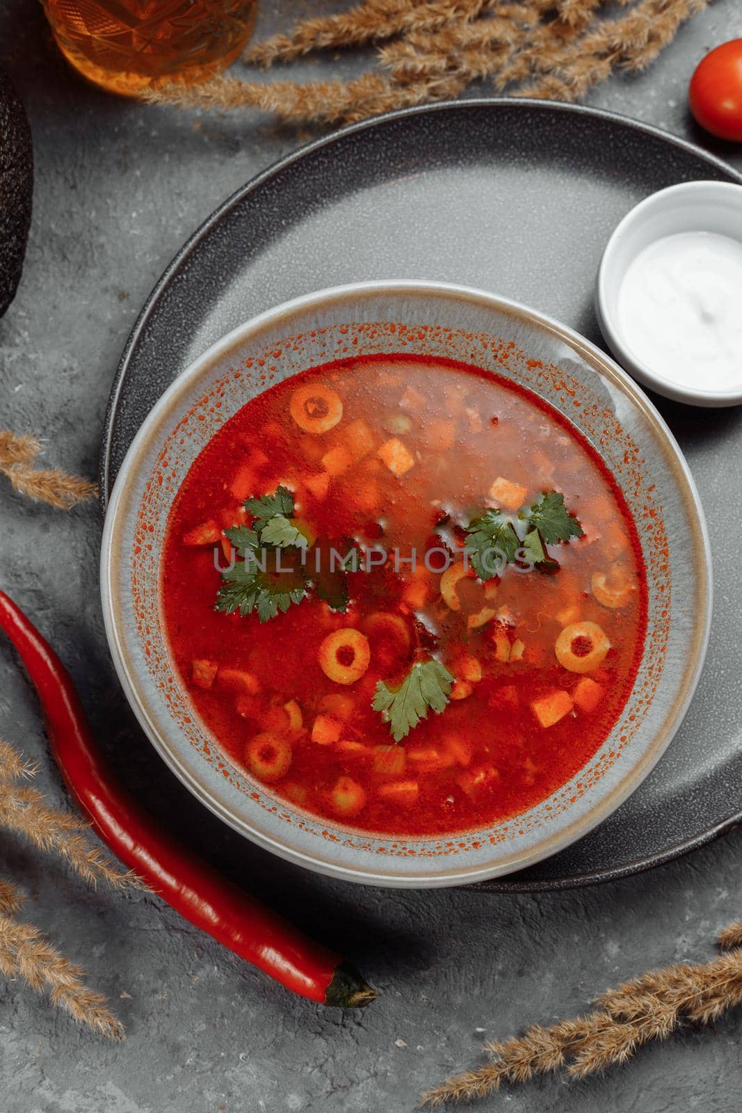Traditional russian Solyanka or saltwort soup. Selective focus. photo for the menu, traditional food by UcheaD