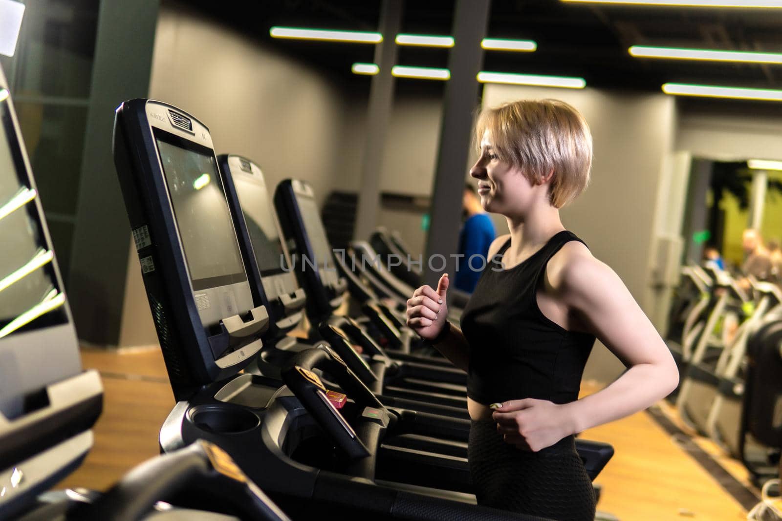 Simulator track workout run activity, in the afternoon exercise healthy in fitness jogging health, machine wellness. Indoor recreation legs, action