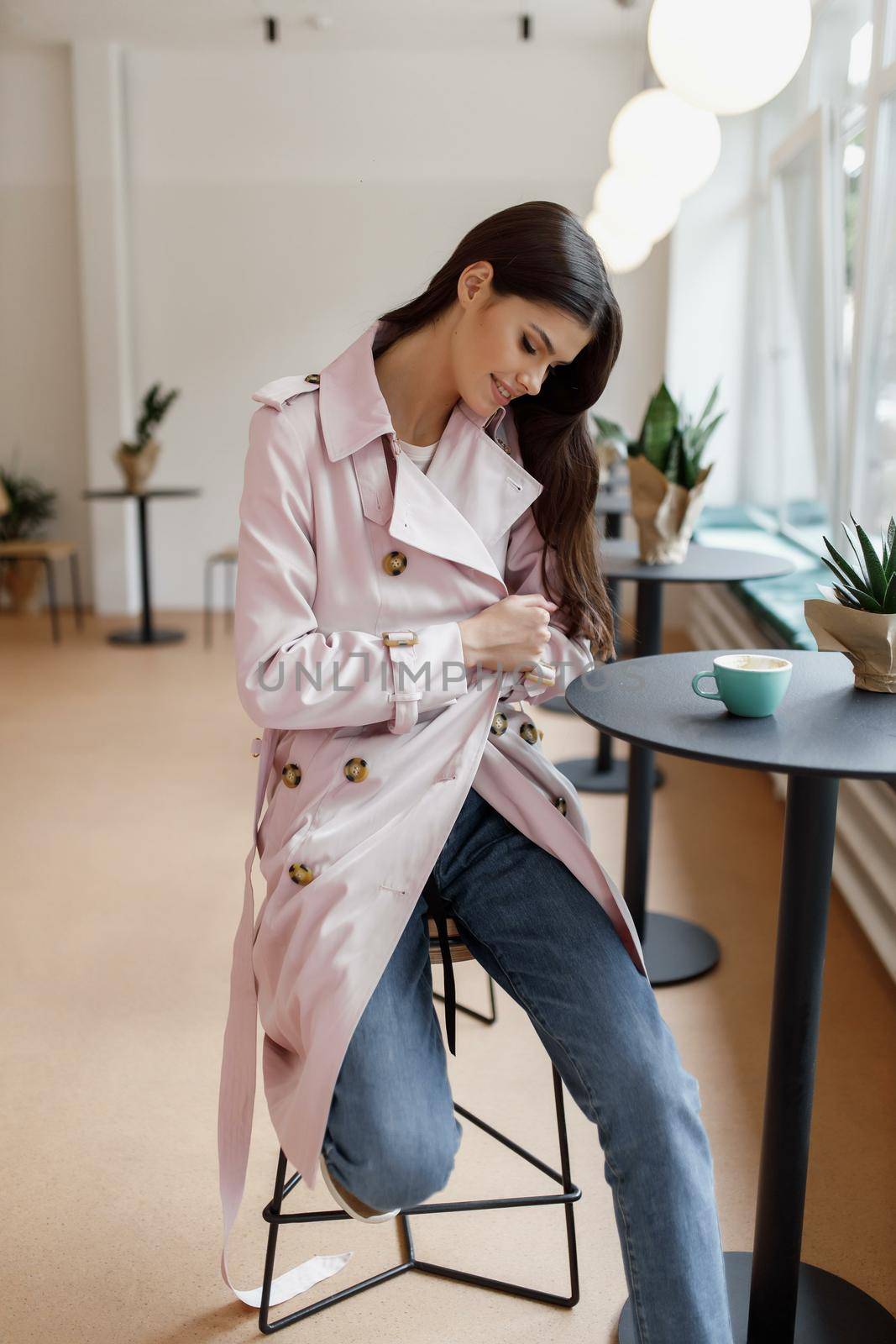 beautiful women in a coffee shop with a cup of coffee.