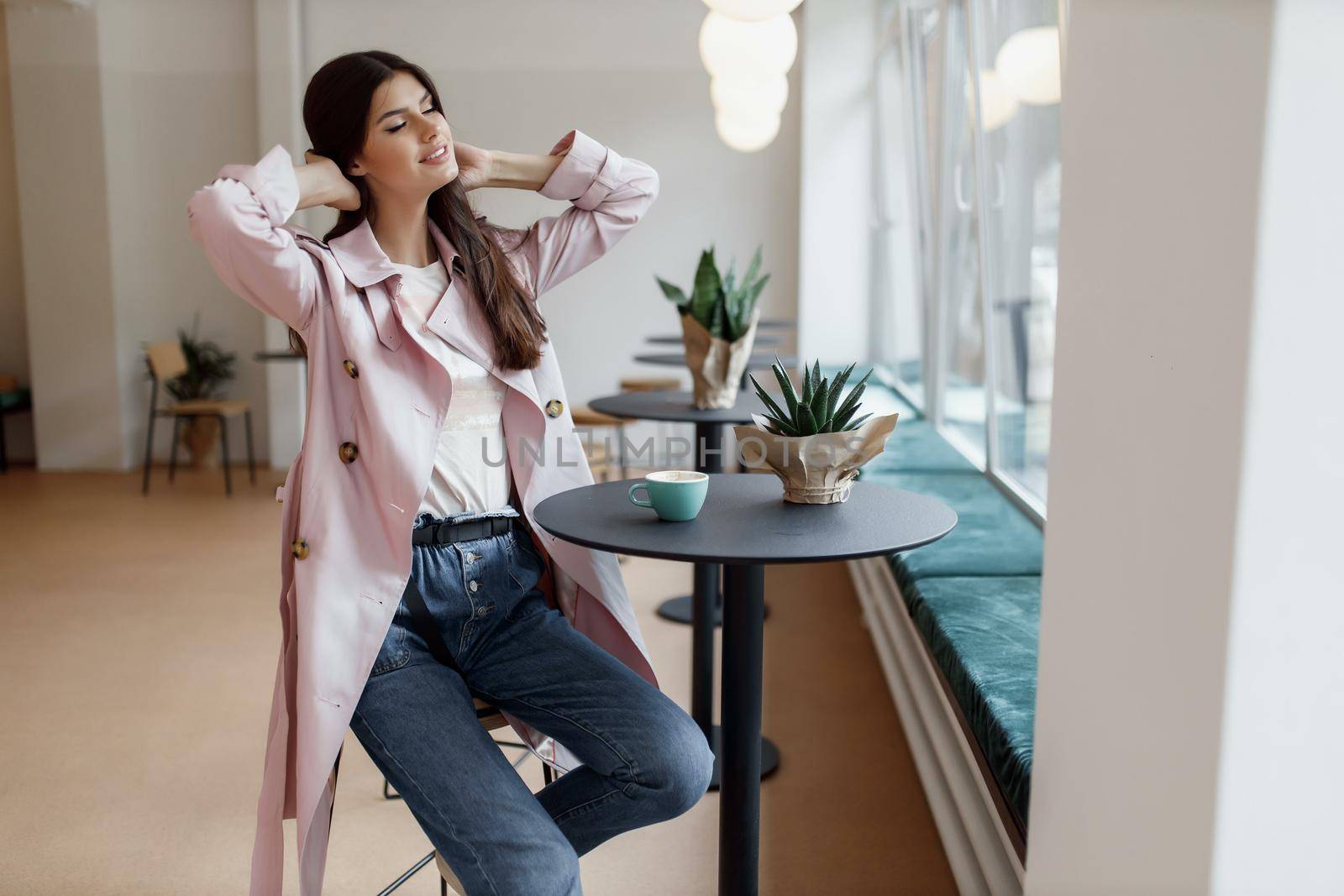 beautiful women in a coffee shop with a cup of coffee.