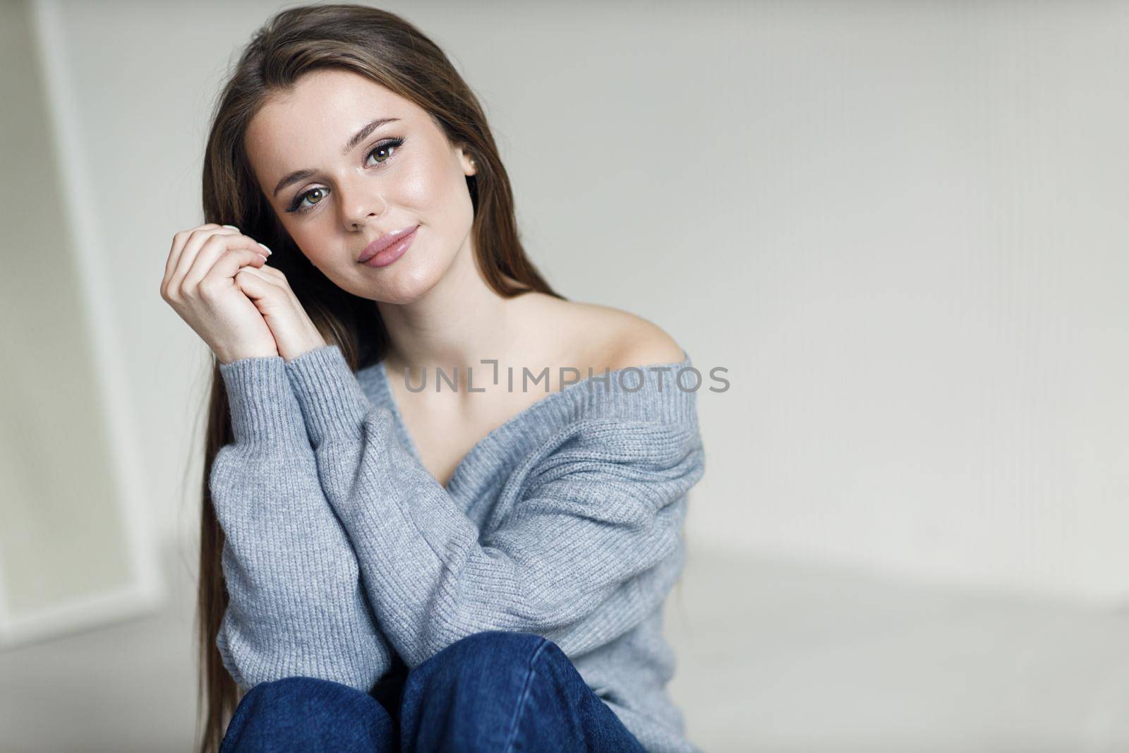Young beautiful cozy woman indoor. High quality photo