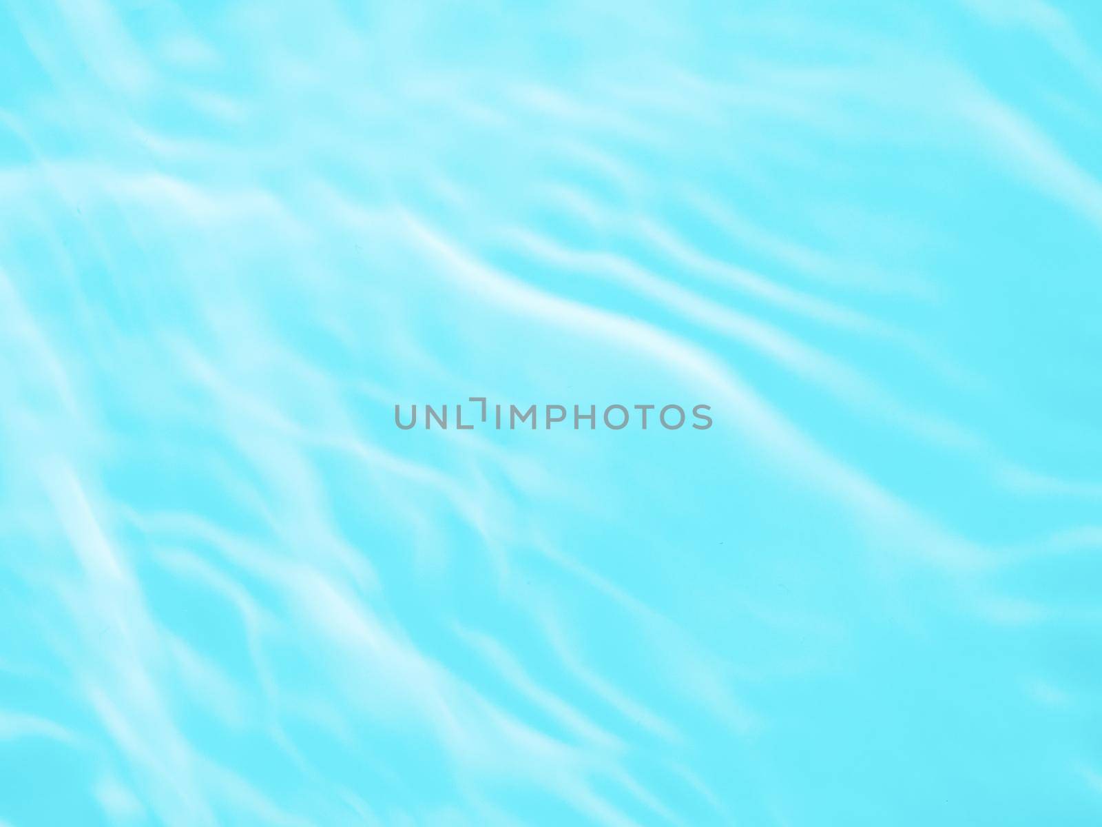Ripple water texture on blue pool background. Shadow of water on sunlight. Mockup for product, spa or travel background. Marble blue water surface as wallpaper background