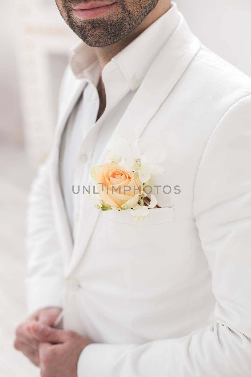 Elegant young handsome man with a beard in a white classic suit. by StudioPeace