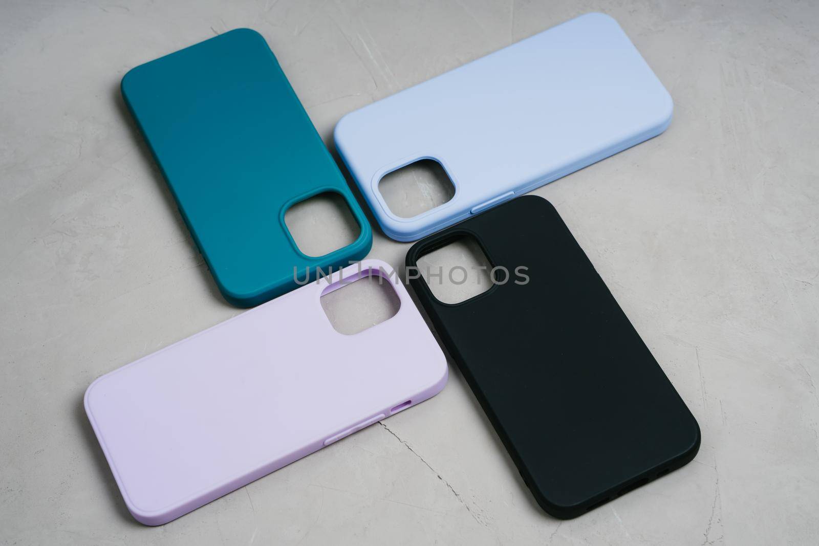 Cases set for smartphone on grey background. Silicone protection for mobile phone. Colorful silicone phone cases.