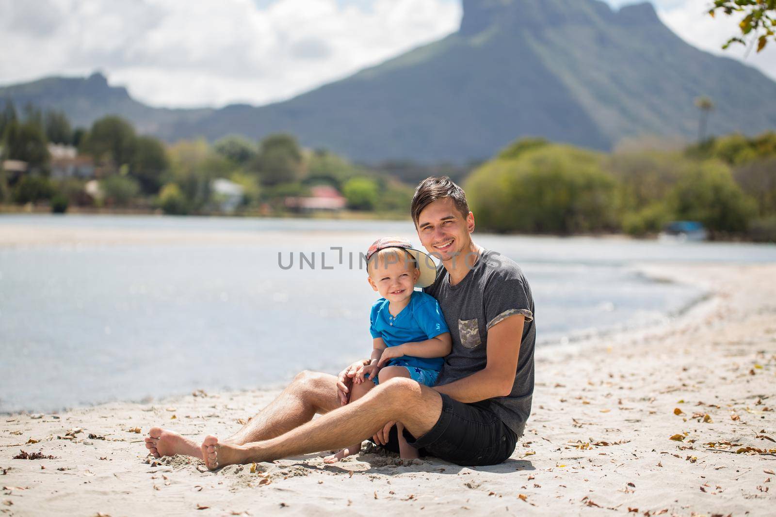 Father and son on the island Mauritius. by StudioPeace