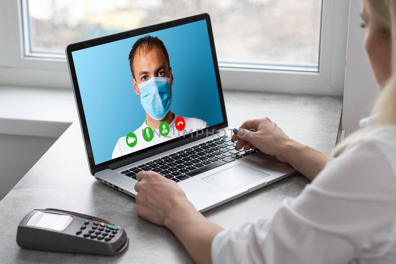 Close up of young female talk on video call consult with diverse doctors colleagues, woman patient have online consultation with GP or physicians, medical nurse in Webcam conference with coworkers