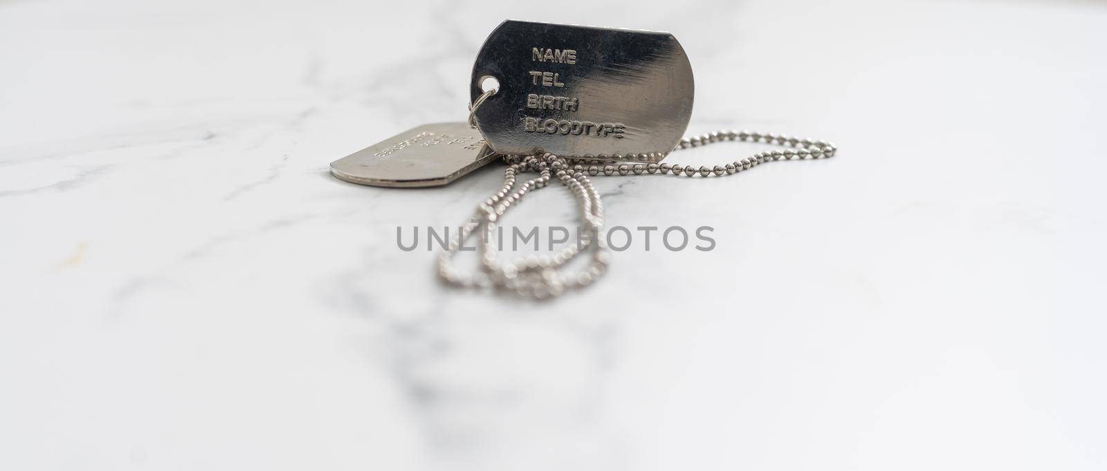 Old and worn military dog tags - Blank.