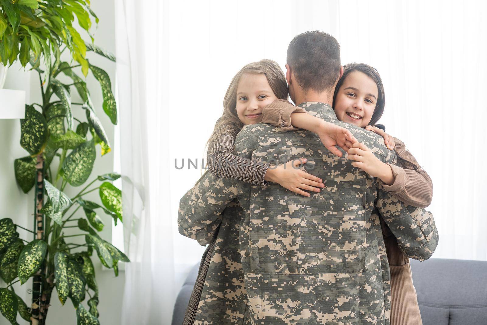 military father and two daughters at home.
